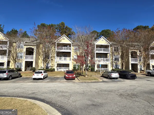 a view of a big building in front of retail shop