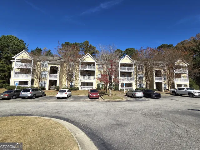 a view of a parked cars in front of a building