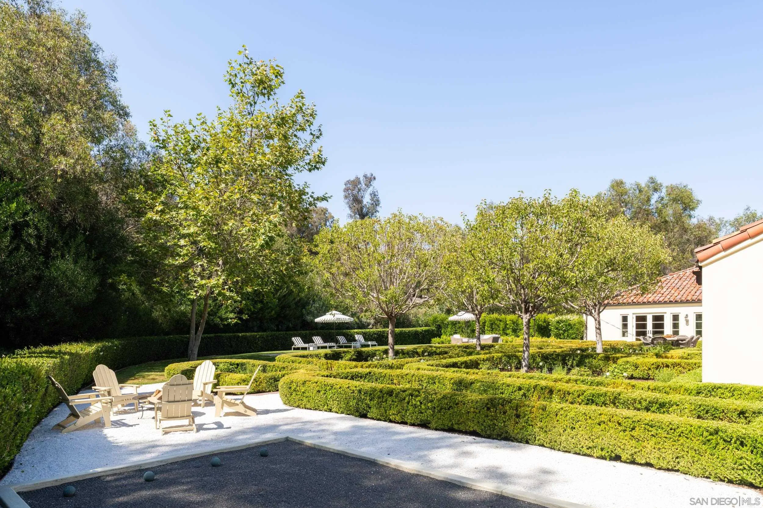 5406 Calzada Del Bosque Rancho Santa Fe, CA 92067 - Photo 25 of 30 a view of swimming pool with outdoor seating and trees