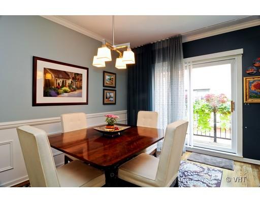 4046 North Clark Street, Unit L Chicago, IL 60613 - Photo 4 of 10 a view of a dining room with furniture window and outside view