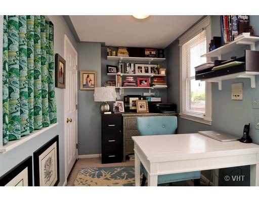 4046 North Clark Street, Unit L Chicago, IL 60613 - Photo 6 of 10 a kitchen view with furniture a refrigerator and a stove