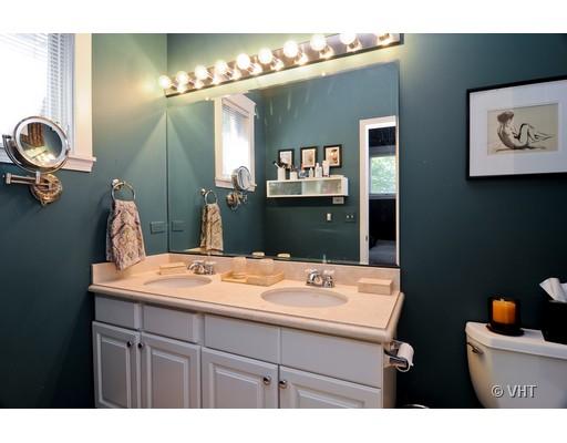4046 North Clark Street, Unit L Chicago, IL 60613 - Photo 8 of 10 a bathroom with a sink and a mirror