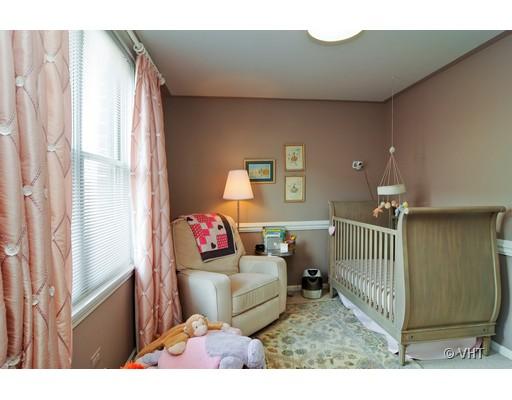 4046 North Clark Street, Unit L Chicago, IL 60613 - Photo 9 of 10 a living room with furniture and a window