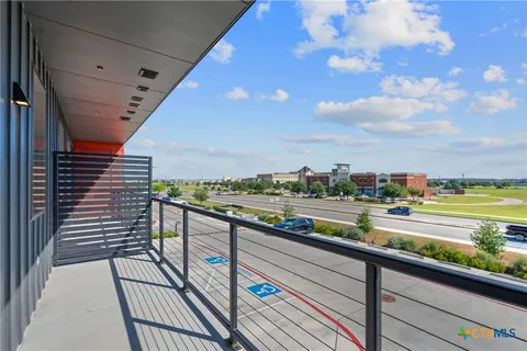 a view of swimming pool with outdoor seating