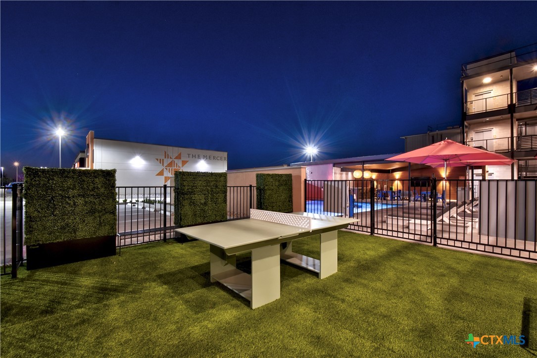 2165 Gabriels Place, Unit 1203 New Braunfels, TX 78130 - Photo 27 of 38 a view of a swimming pool with a patio