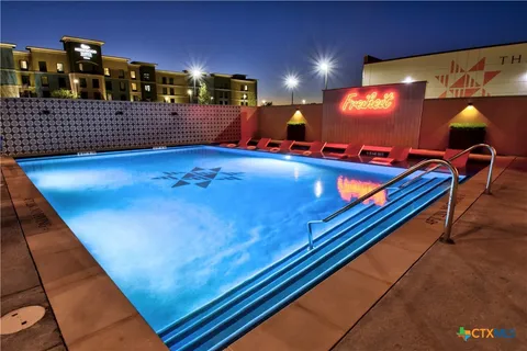 a living room with furniture and a pool