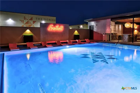 a front view of a building with garden