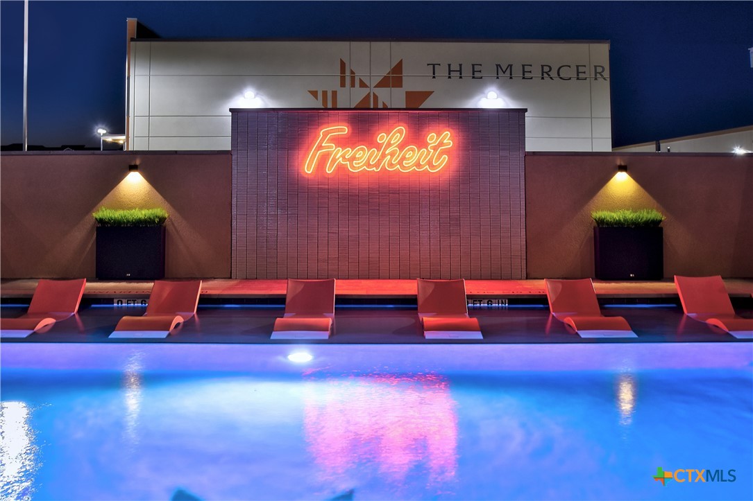 2165 Gabriels Place, Unit 1203 New Braunfels, TX 78130 - Photo 30 of 38 a living room with furniture and a pool