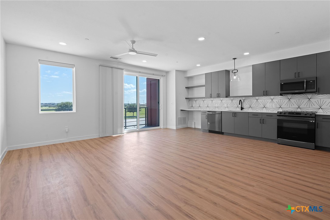 2165 Gabriels Place, Unit 1203 New Braunfels, TX 78130 - Photo 8 of 38 a view of kitchen and microwave