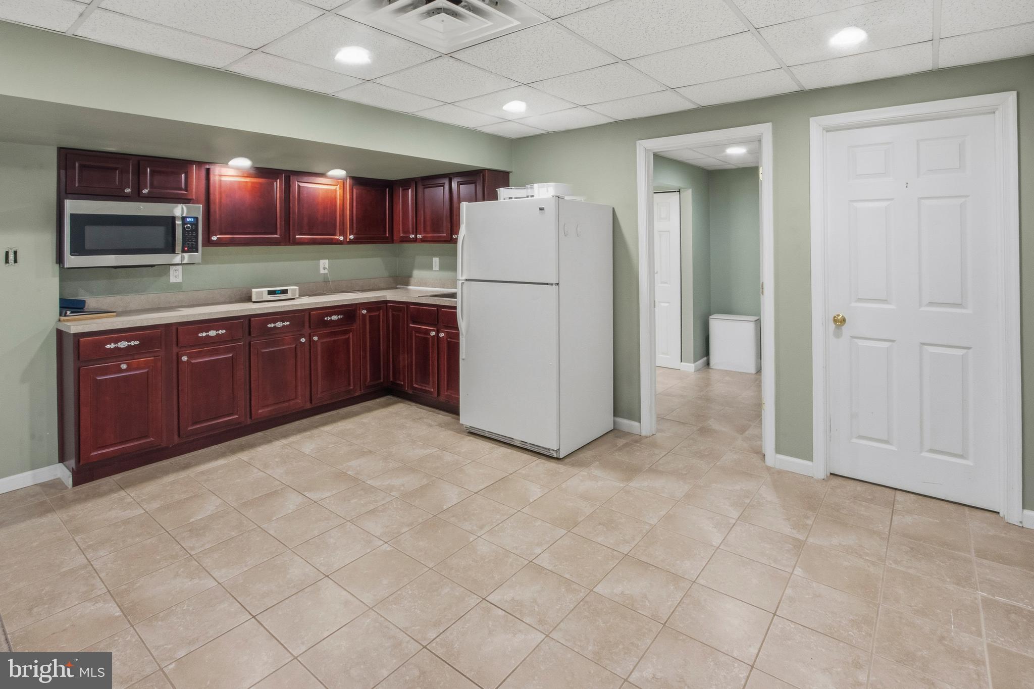 15 Hollybrook Road Mullica Hill, NJ 08062 - Photo 31 of 38 a kitchen with granite countertop a refrigerator and a sink