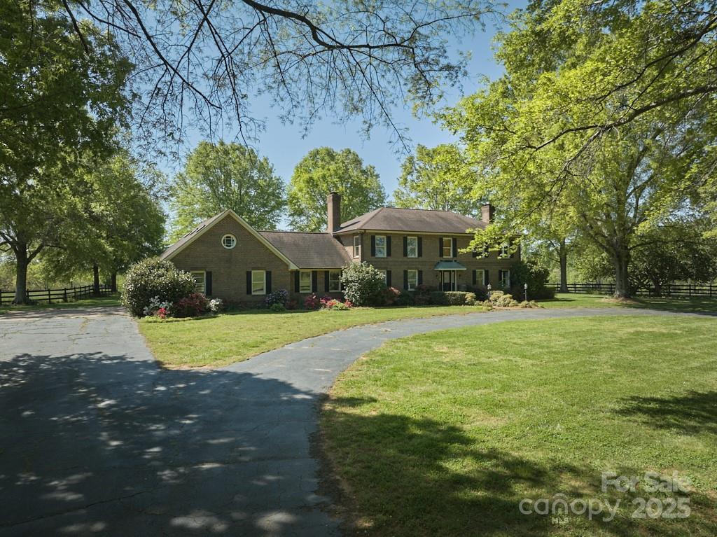 820 Phillips Road Columbus, NC 28722 - Photo 1 of 32 a view of a house with a yard and sitting area