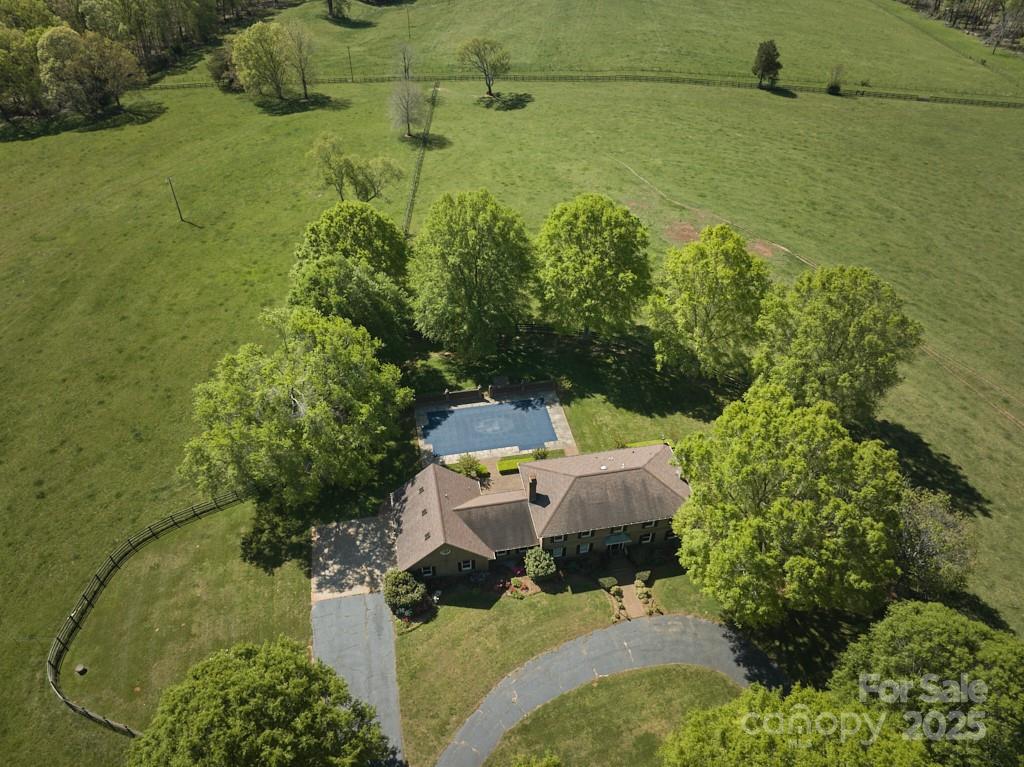 820 Phillips Road Columbus, NC 28722 - Photo 14 of 32 an aerial view of a house with a yard basket ball court and outdoor seating