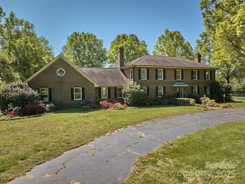 820 Phillips Road Columbus, NC 28722 - Photo 15 of 32 a front view of a house with garden