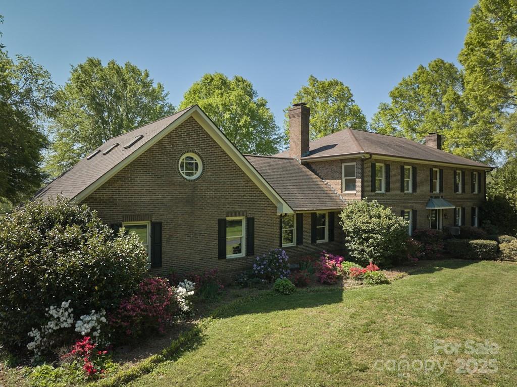 820 Phillips Road Columbus, NC 28722 - Photo 16 of 32 front view of a house with a yard