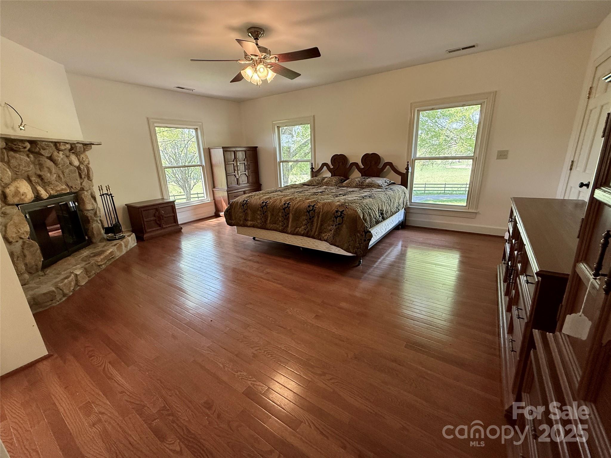 820 Phillips Road Columbus, NC 28722 - Photo 24 of 32 a bedroom with a bed a couch and dresser