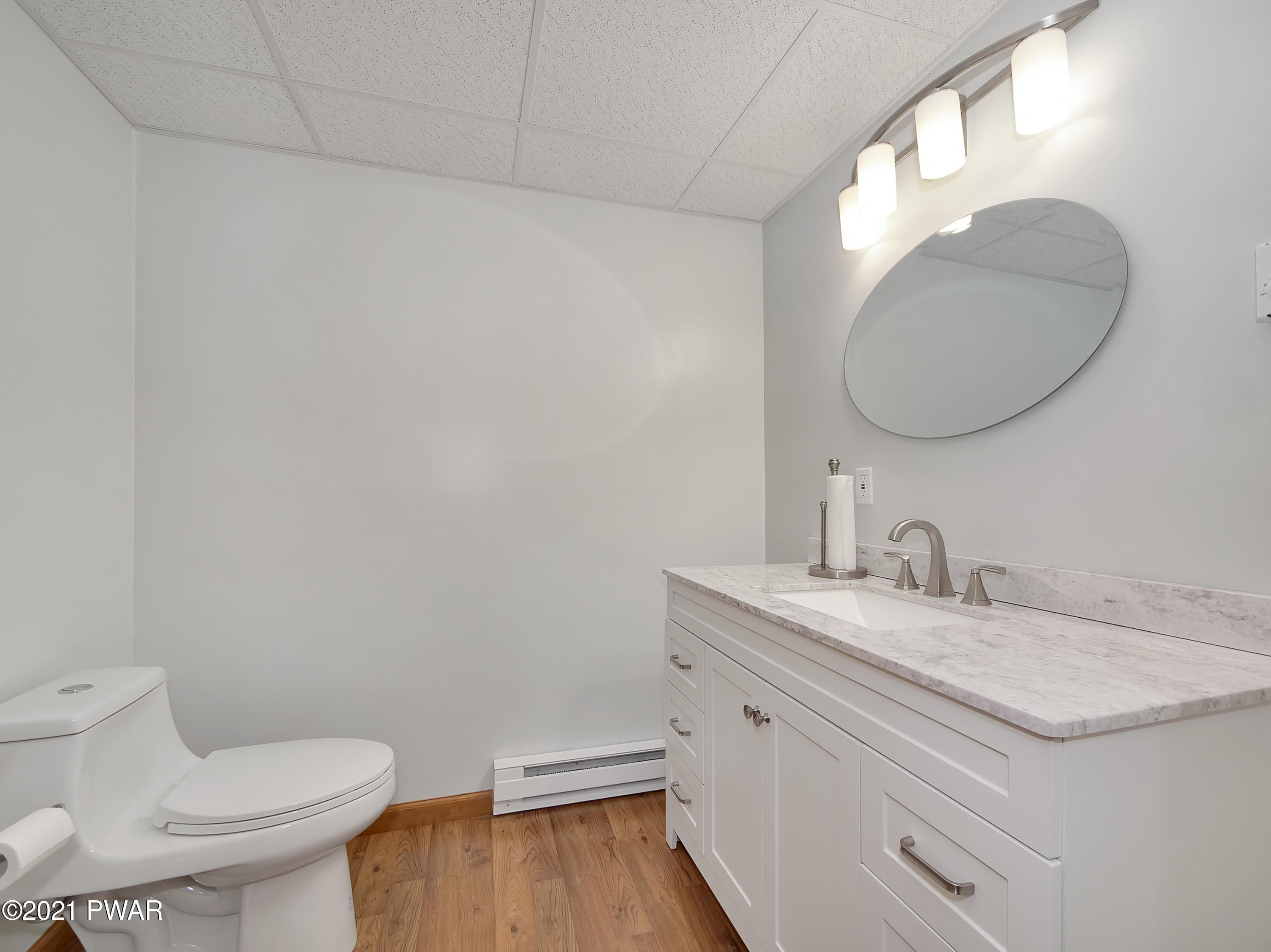 149 Yale Road Milford, PA 18337 - Photo 6 of 29 a bathroom with a granite countertop toilet sink and mirror