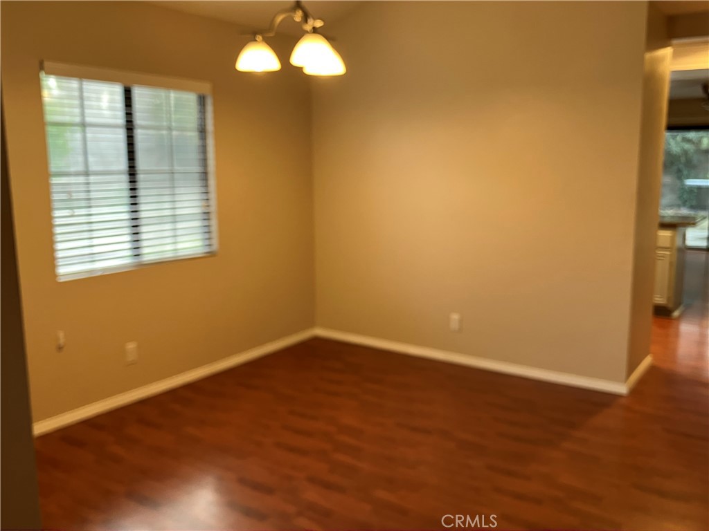 19933 Ralph Street Walnut, CA 91789 - Photo 17 of 77 a view of an empty room with wooden floor and a window