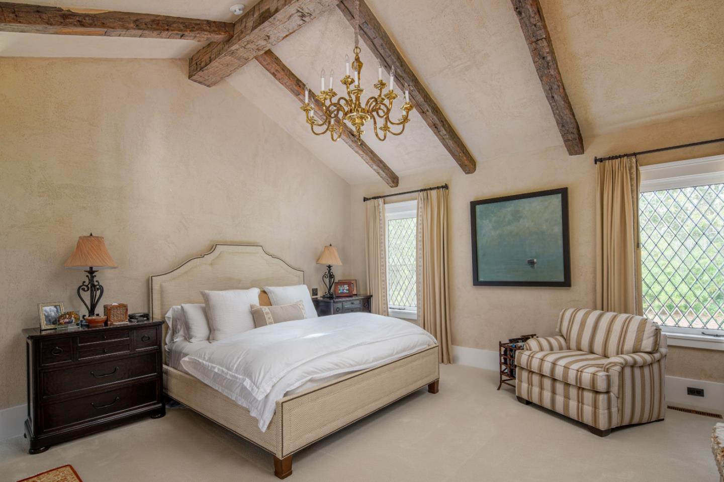 1456 Riata Road Pebble Beach, CA 93953 - Photo 13 of 32 a bedroom with a bed and a couch