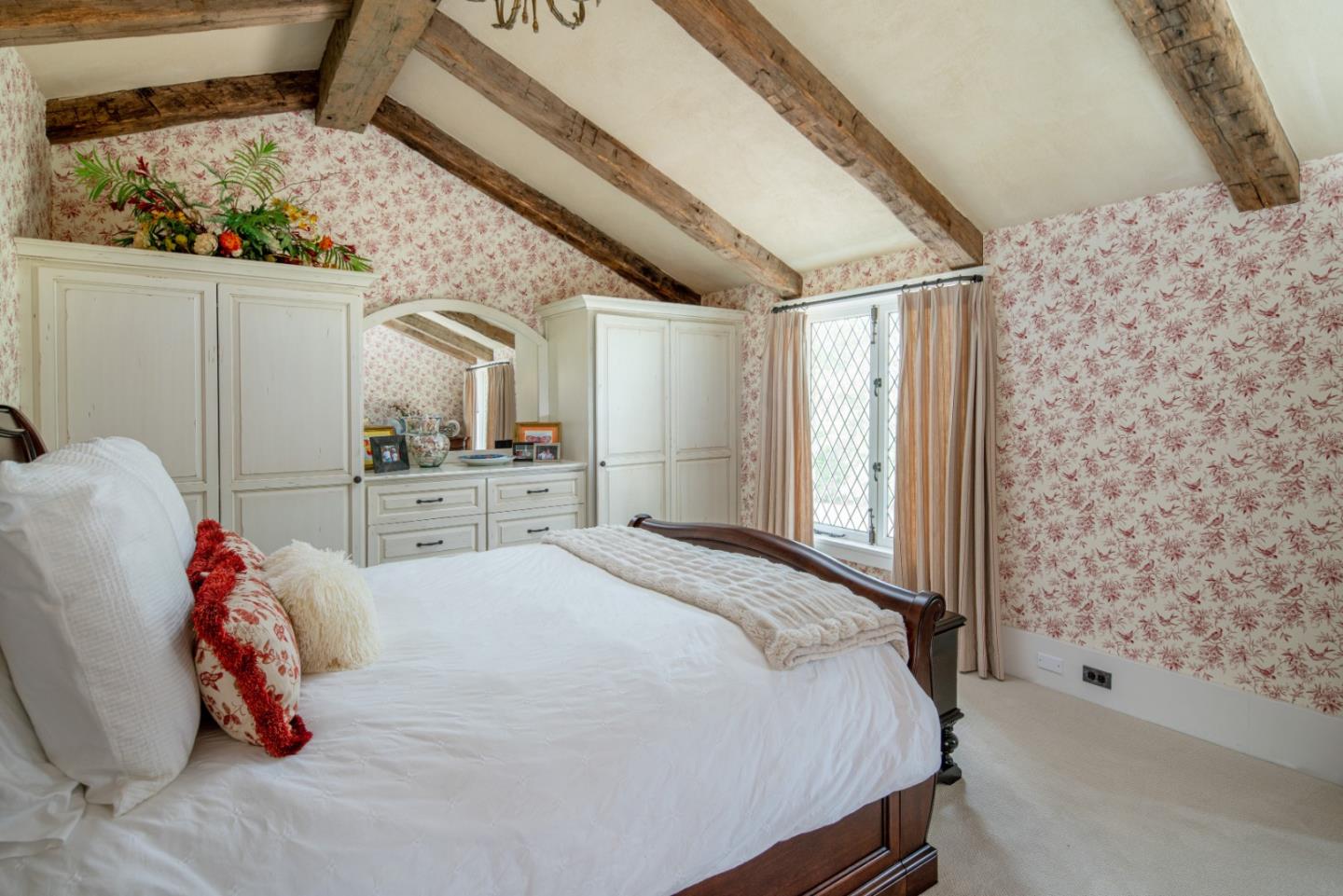 1456 Riata Road Pebble Beach, CA 93953 - Photo 17 of 32 a bedroom with a bed and a window