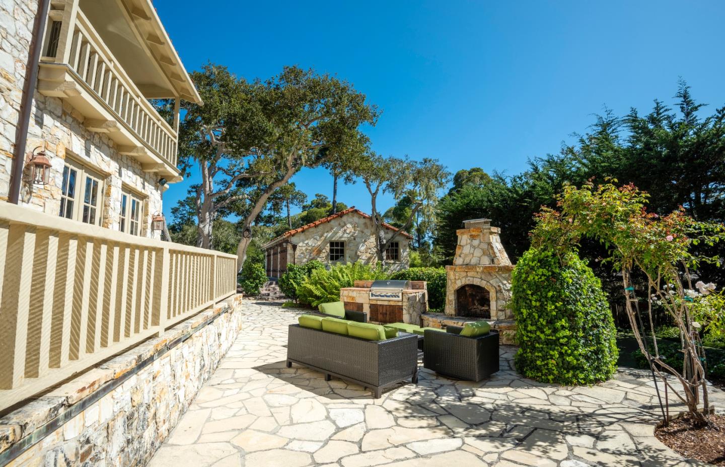 1456 Riata Road Pebble Beach, CA 93953 - Photo 23 of 32 a front view of a house with plants