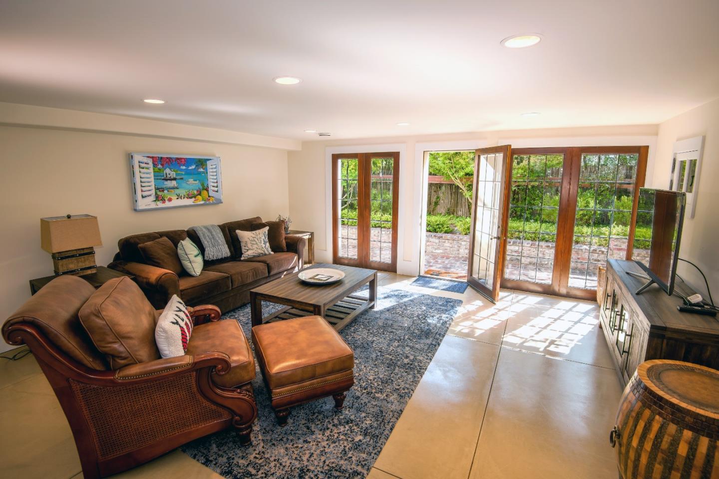 1456 Riata Road Pebble Beach, CA 93953 - Photo 26 of 32 a living room with furniture and a flat screen tv