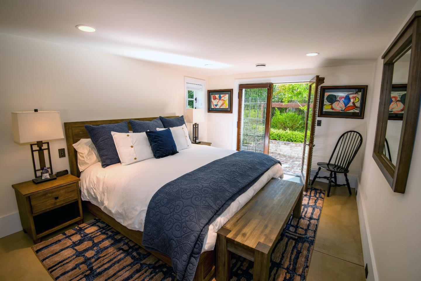 1456 Riata Road Pebble Beach, CA 93953 - Photo 27 of 32 a bed room with a bed and a tv