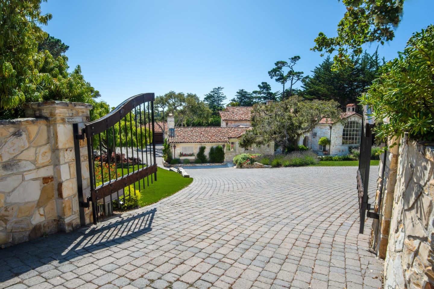1456 Riata Road Pebble Beach, CA 93953 - Photo 31 of 32 a view of a pathway with a wrought fence