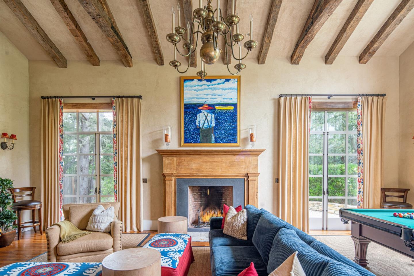 1456 Riata Road Pebble Beach, CA 93953 - Photo 5 of 32 a living room with furniture a fireplace and a floor to ceiling window