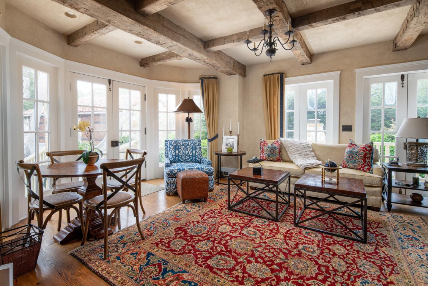 1456 Riata Road Pebble Beach, CA 93953 - Photo 8 of 32 a living room with furniture wooden floor and a chandelier