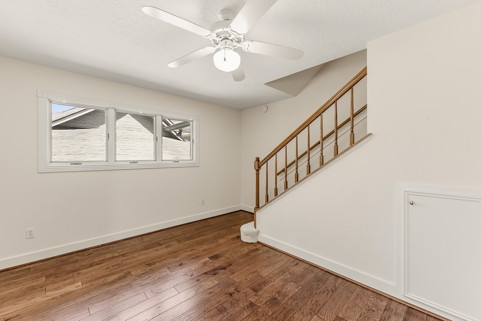 2008 Wickersham Drive Huntsville, TX 77340 - Photo 31 of 44 a view of an empty room with wooden floor and a ceiling fan