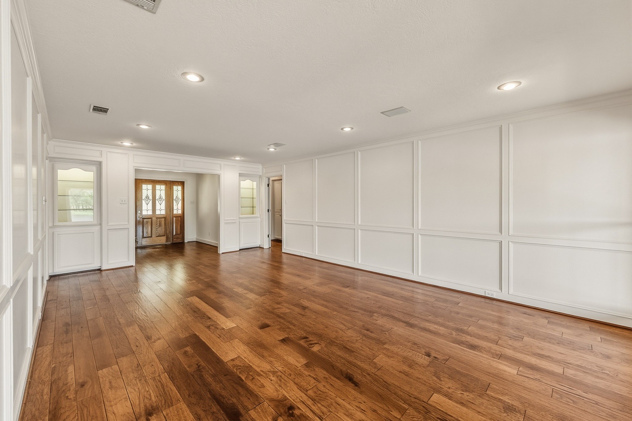 2008 Wickersham Drive Huntsville, TX 77340 - Photo 42 of 44 a view of an empty room with wooden floor