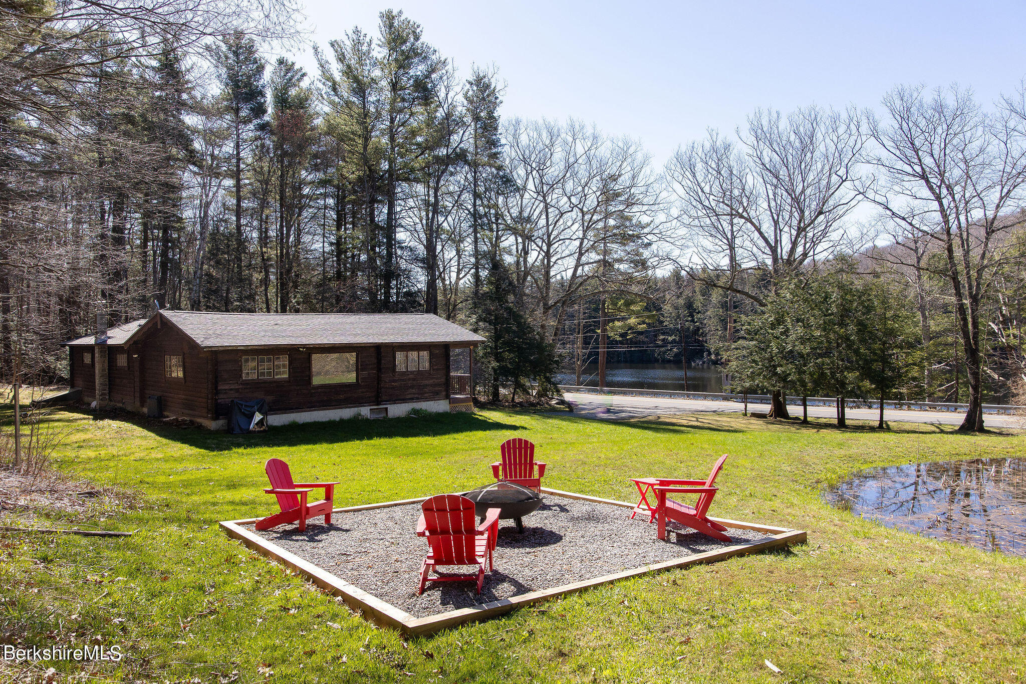 2184 Monterey Road Otis, MA 01253 - Photo 1 of 32 a view of a swimming pool with a yard and swimming pool
