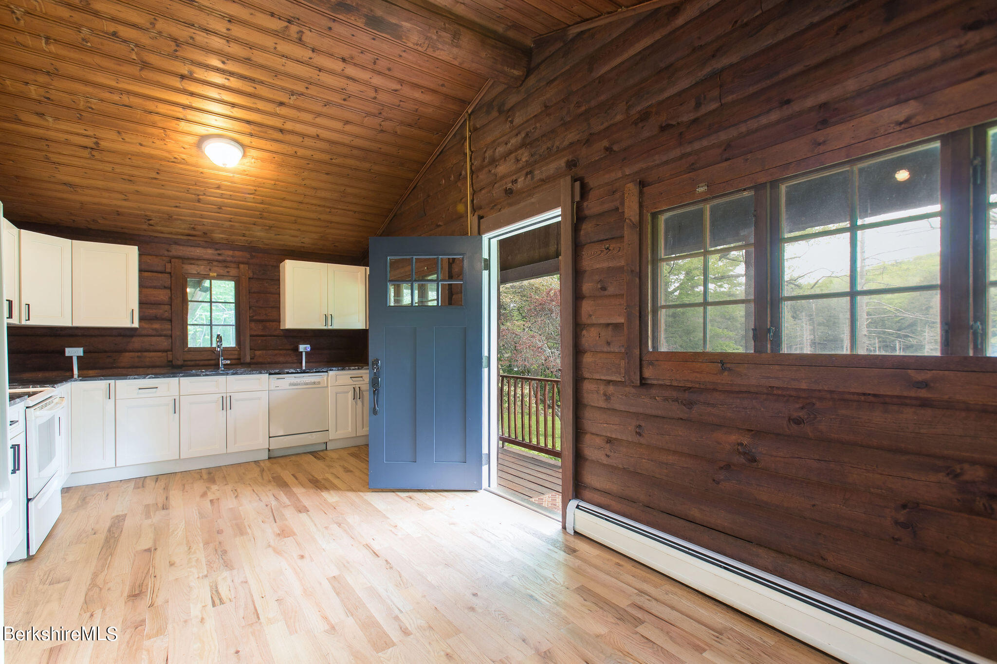 2184 Monterey Road Otis, MA 01253 - Photo 13 of 32 a kitchen with granite countertop wooden cabinets and white appliances