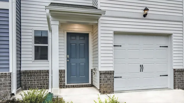 a view of a brick house with large windows