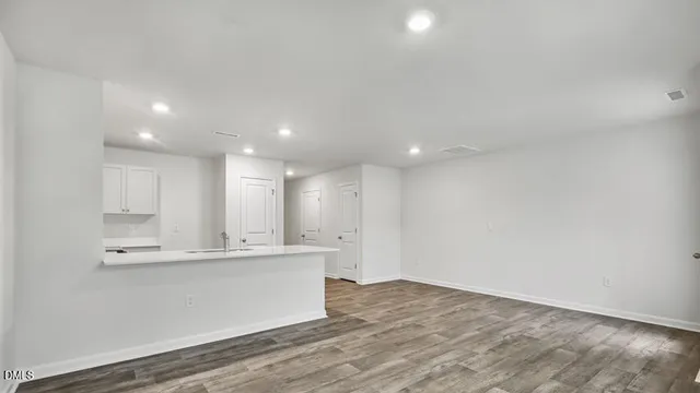 a kitchen with a sink stove and microwave