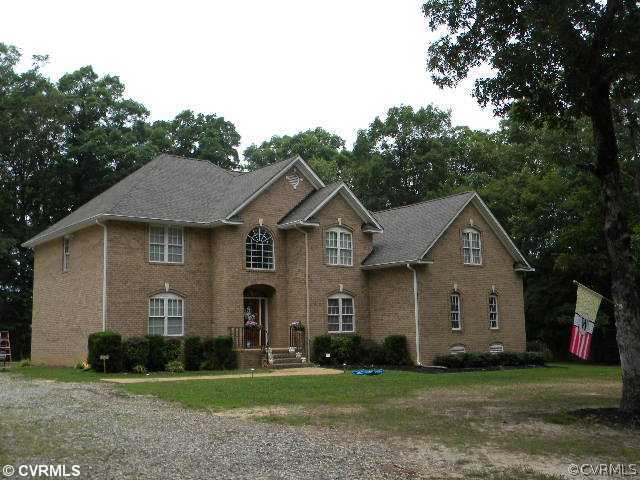 8800 Strath Road Richmond, VA 23231 - Photo 1 of 10 a front view of a house with a yard