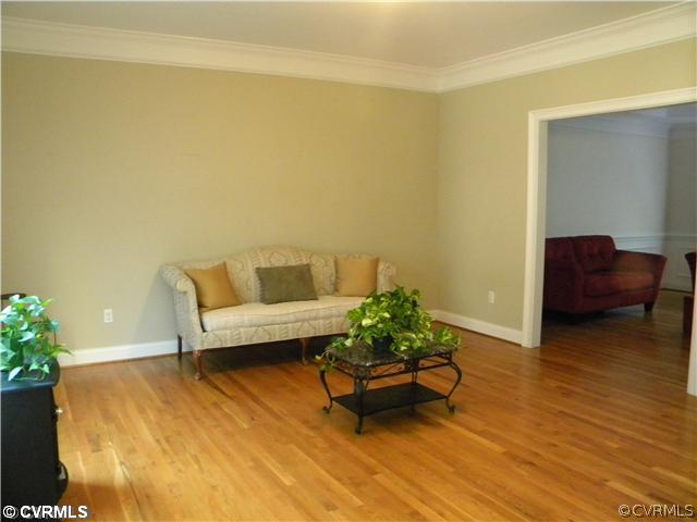8800 Strath Road Richmond, VA 23231 - Photo 2 of 10 a living room with furniture and flowers