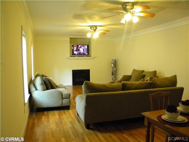 8800 Strath Road Richmond, VA 23231 - Photo 3 of 10 a living room with furniture and a flat screen tv