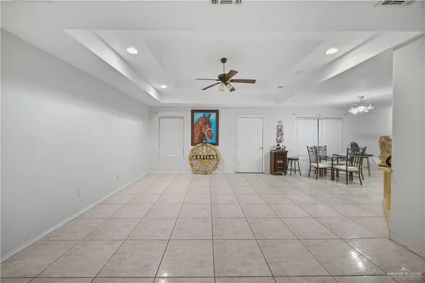 a view of a livingroom with furniture and a ceiling fan
