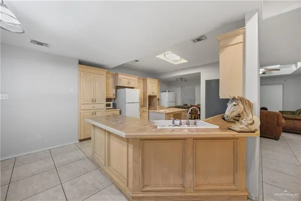 a room with sink washer and dryer