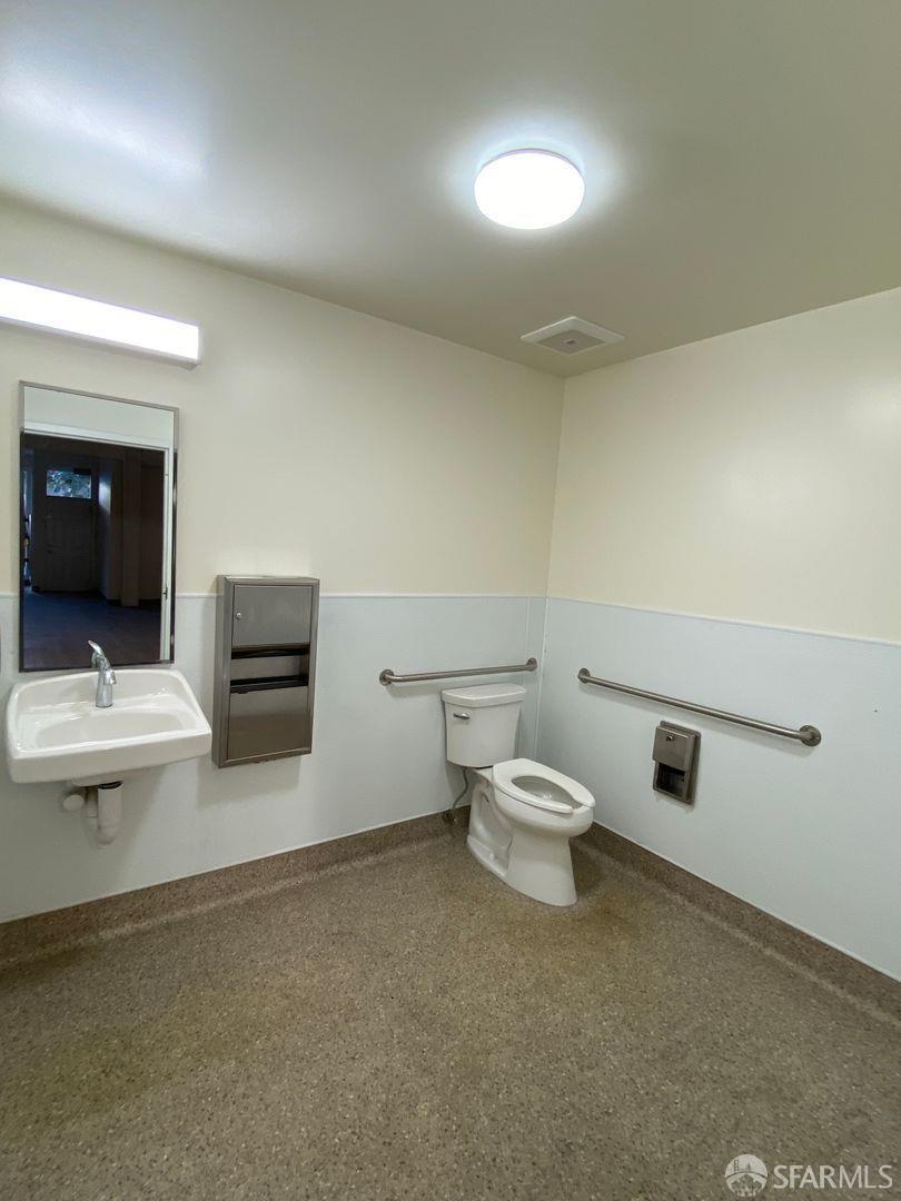 17 Boardman Place San Francisco, CA 94103 - Photo 11 of 17 a white toilet sitting next to a bathroom sink