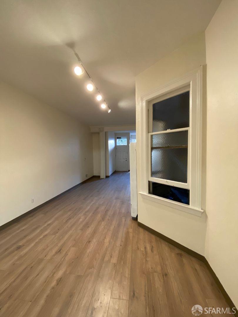 17 Boardman Place San Francisco, CA 94103 - Photo 13 of 17 a view of an empty room with wooden floor and a window