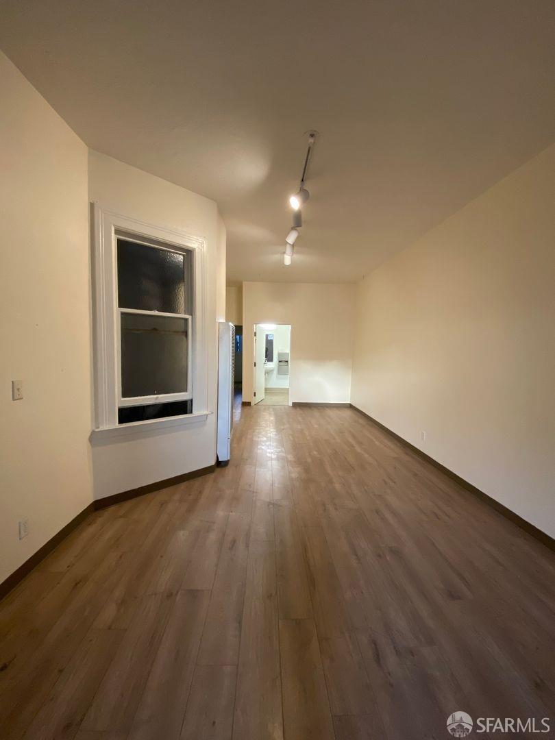 17 Boardman Place San Francisco, CA 94103 - Photo 10 of 17 an empty room with wooden floor cabinet and windows