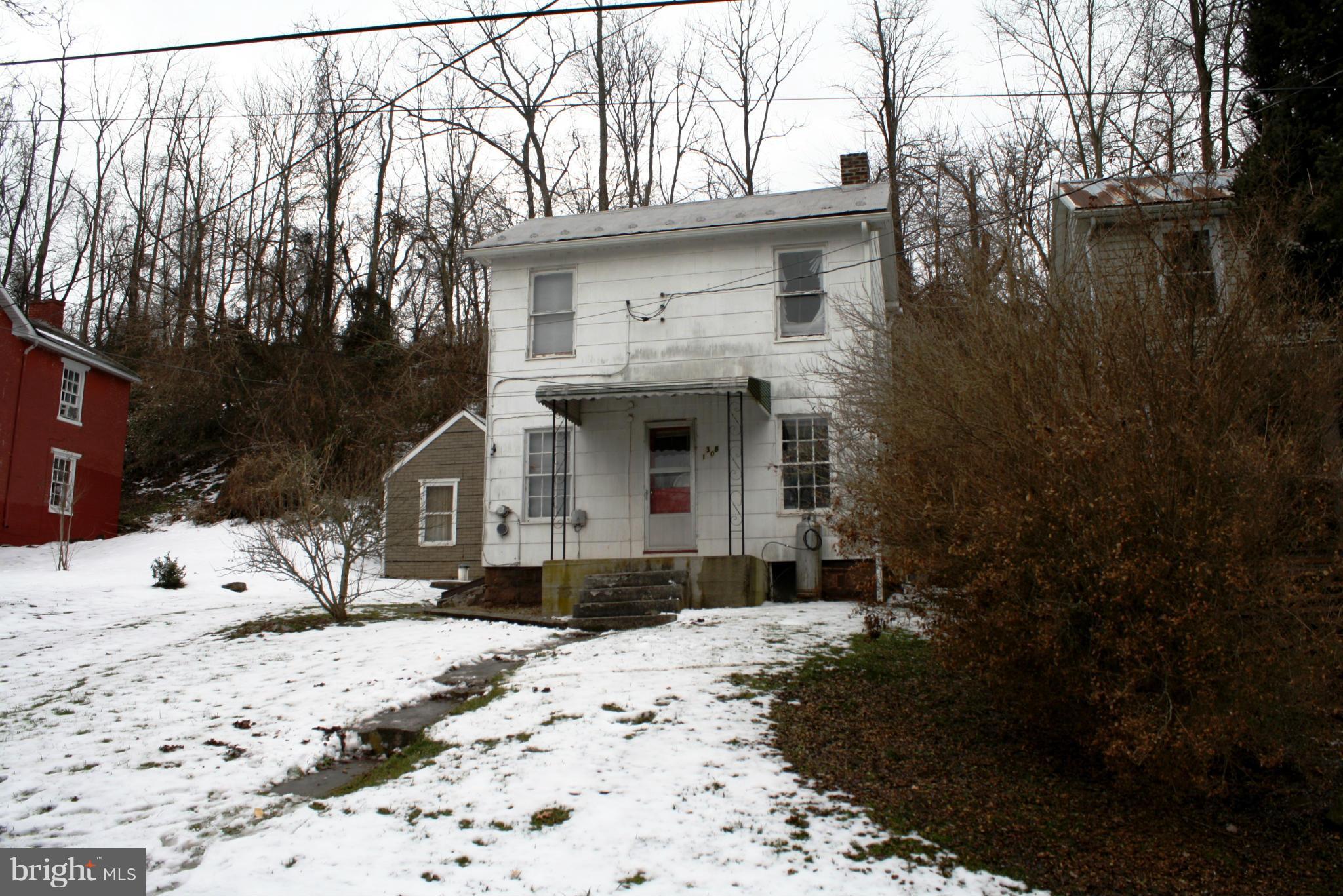 1308 Bruceville Road Keymar, MD 21757 - Photo 17 of 20 a front view of a house with a yard covered with snow