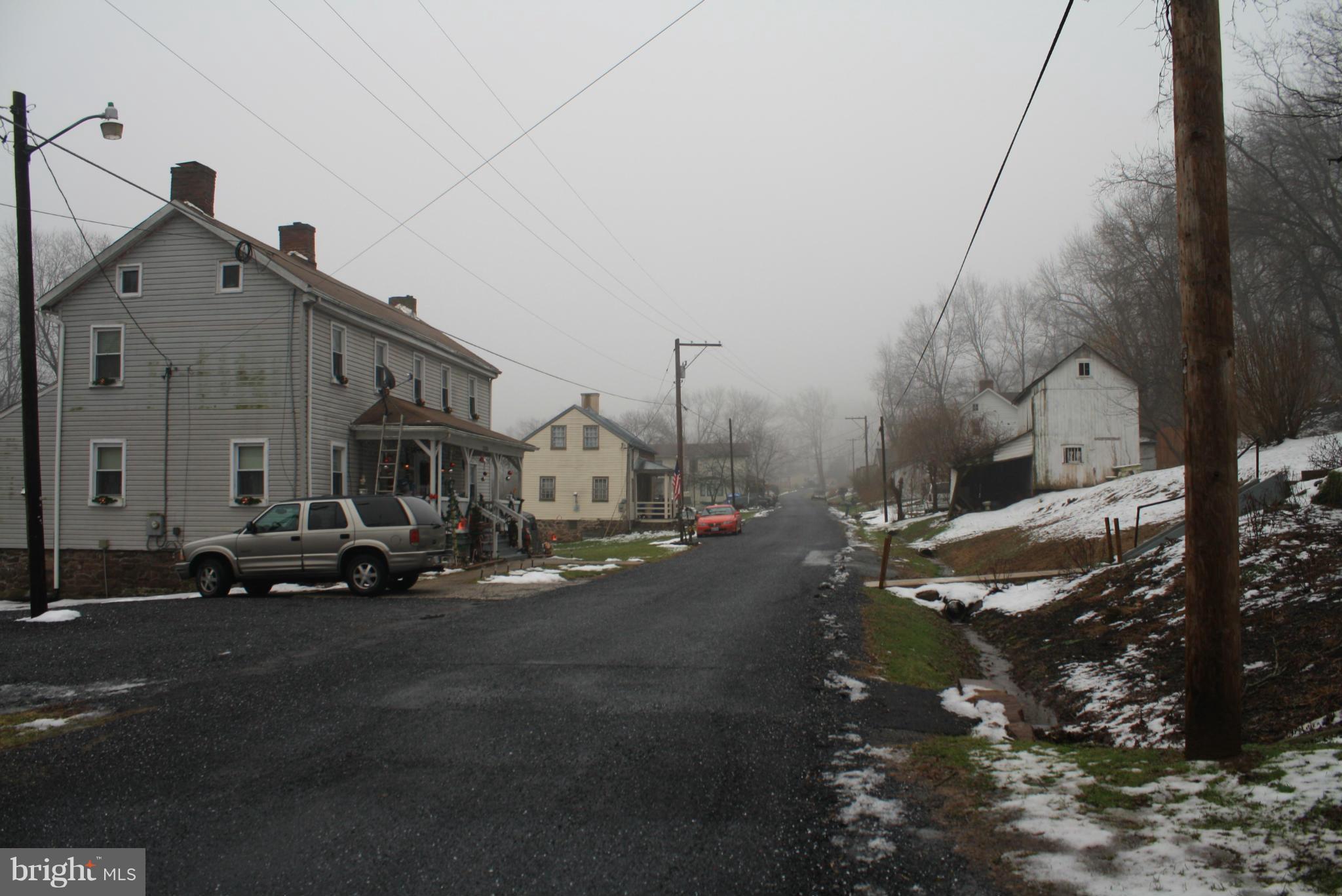 1308 Bruceville Road Keymar, MD 21757 - Photo 19 of 20 a view of a street with cars