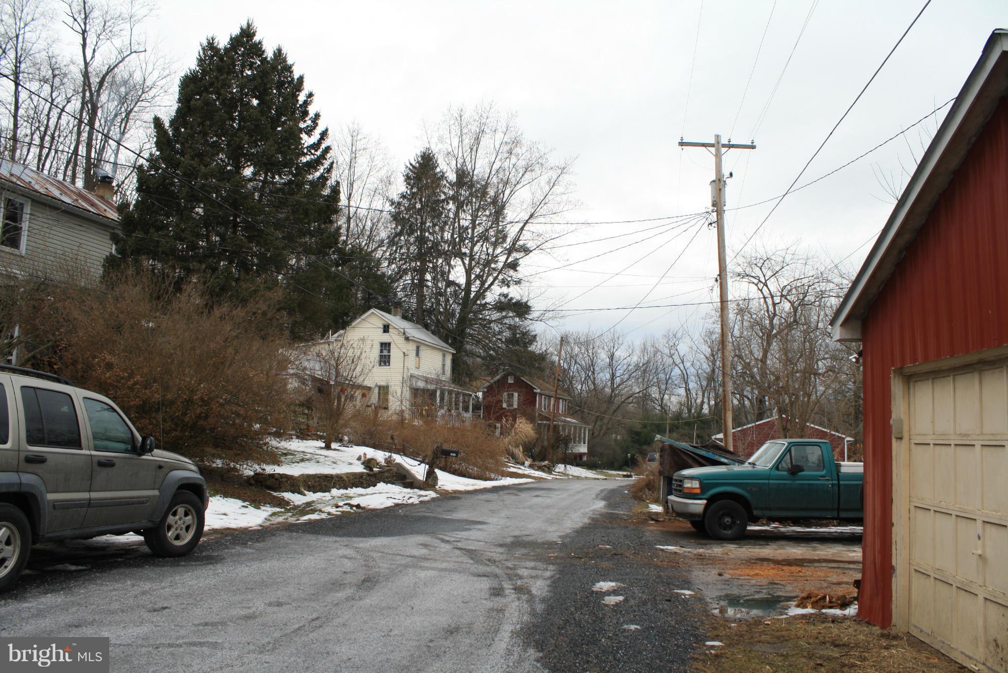1308 Bruceville Road Keymar, MD 21757 - Photo 20 of 20 a car parked in front of a house