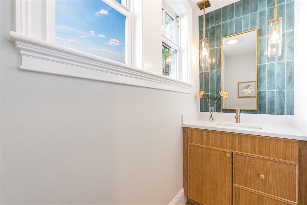 25 Thomas Road Wellesley, MA 02482 - Photo 11 of 27 a bathroom with a sink and a mirror