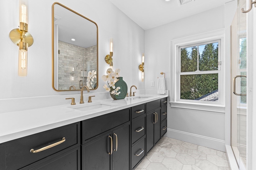 25 Thomas Road Wellesley, MA 02482 - Photo 15 of 27 a bathroom with a sink double vanity and a mirror