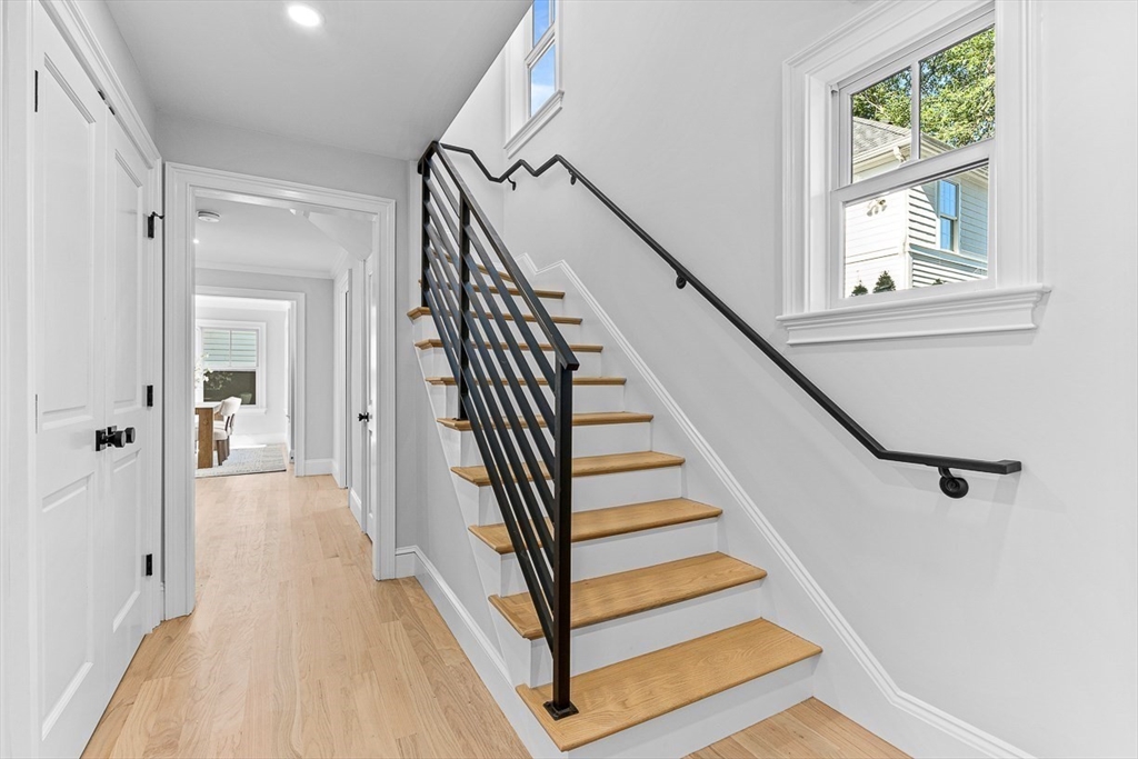25 Thomas Road Wellesley, MA 02482 - Photo 2 of 27 a view of a hallway with wooden floor and staircase