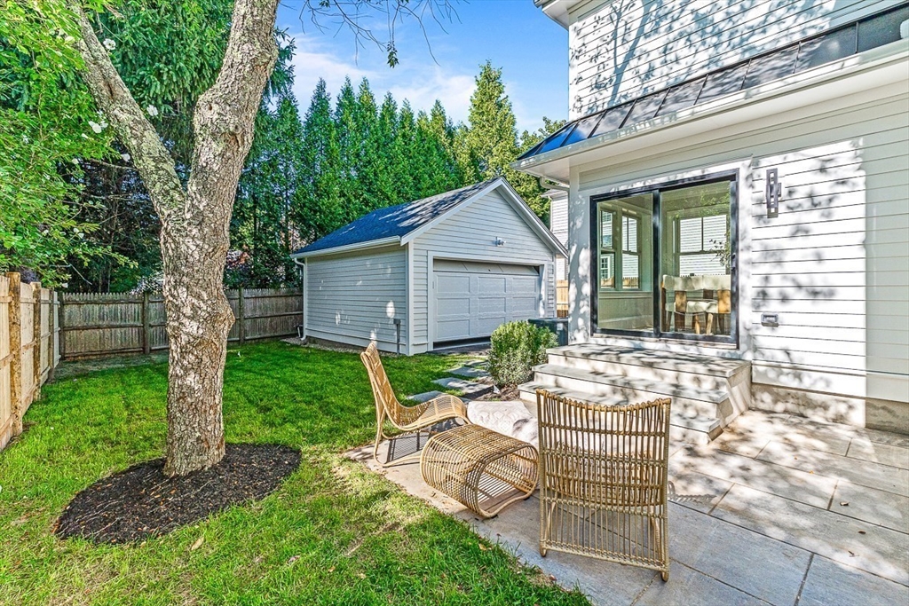 25 Thomas Road Wellesley, MA 02482 - Photo 26 of 27 a view of a house with backyard and sitting area